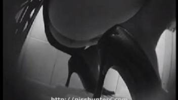 Young woman defecating in the bathroom